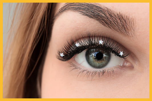 Woman wearing hologram star shape lash decals