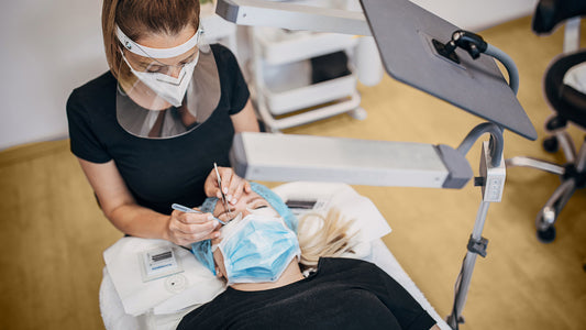 Lash artist doing eyelash extension